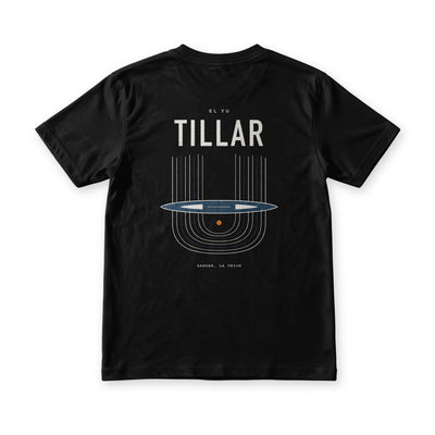 Tillar tee in Midnight Black, back view, TILLAR over an Ilocano handloom drawn as warp threads, shuttle and woven cloth