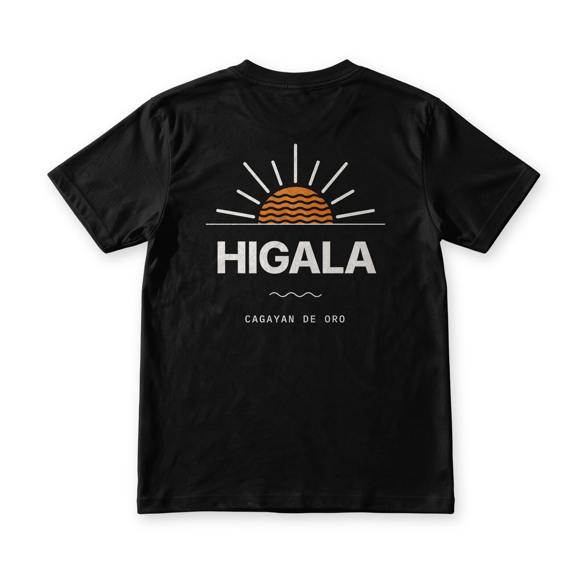 Higala tee in Midnight Black, back view, HIGALA under an orange sunrise with waves inside it and Cagayan de Oro below