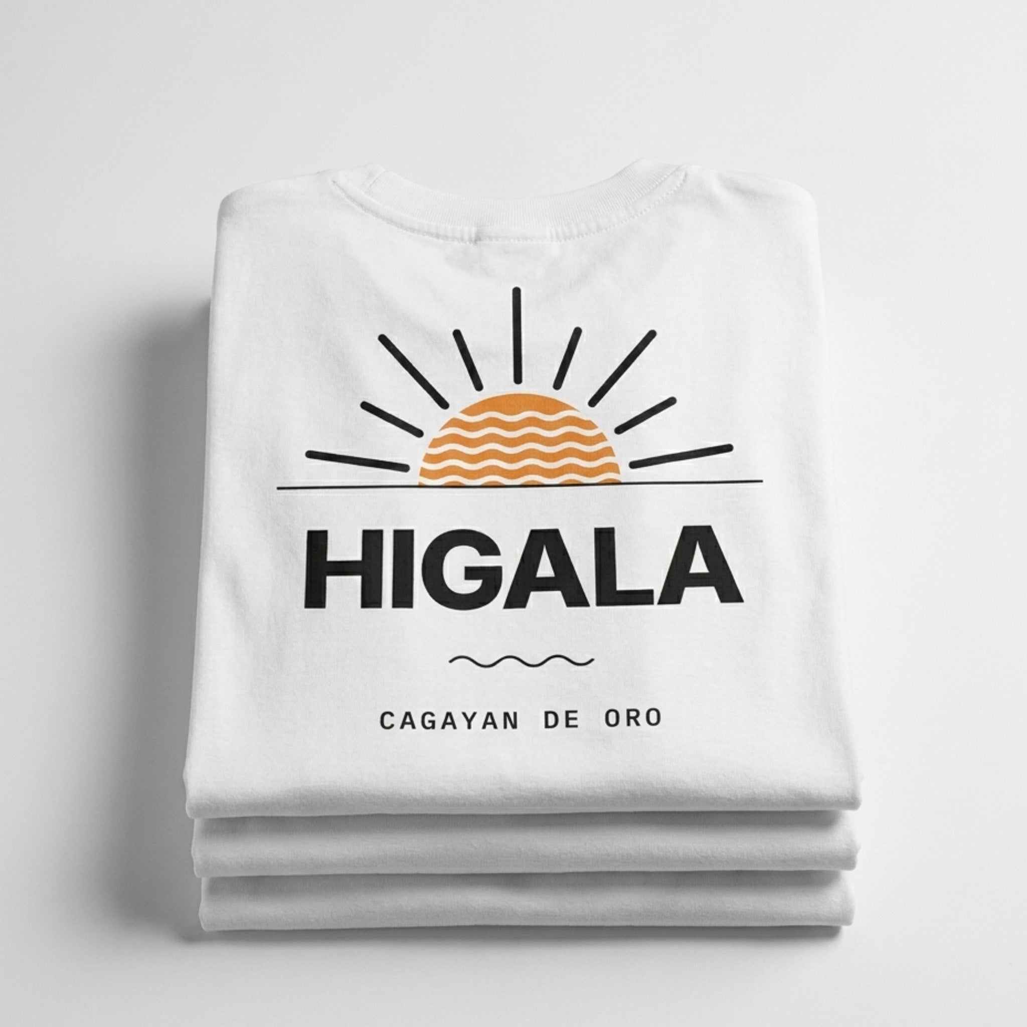 Folded Higala tee showing the sunrise print and Cagayan de Oro on the back panel