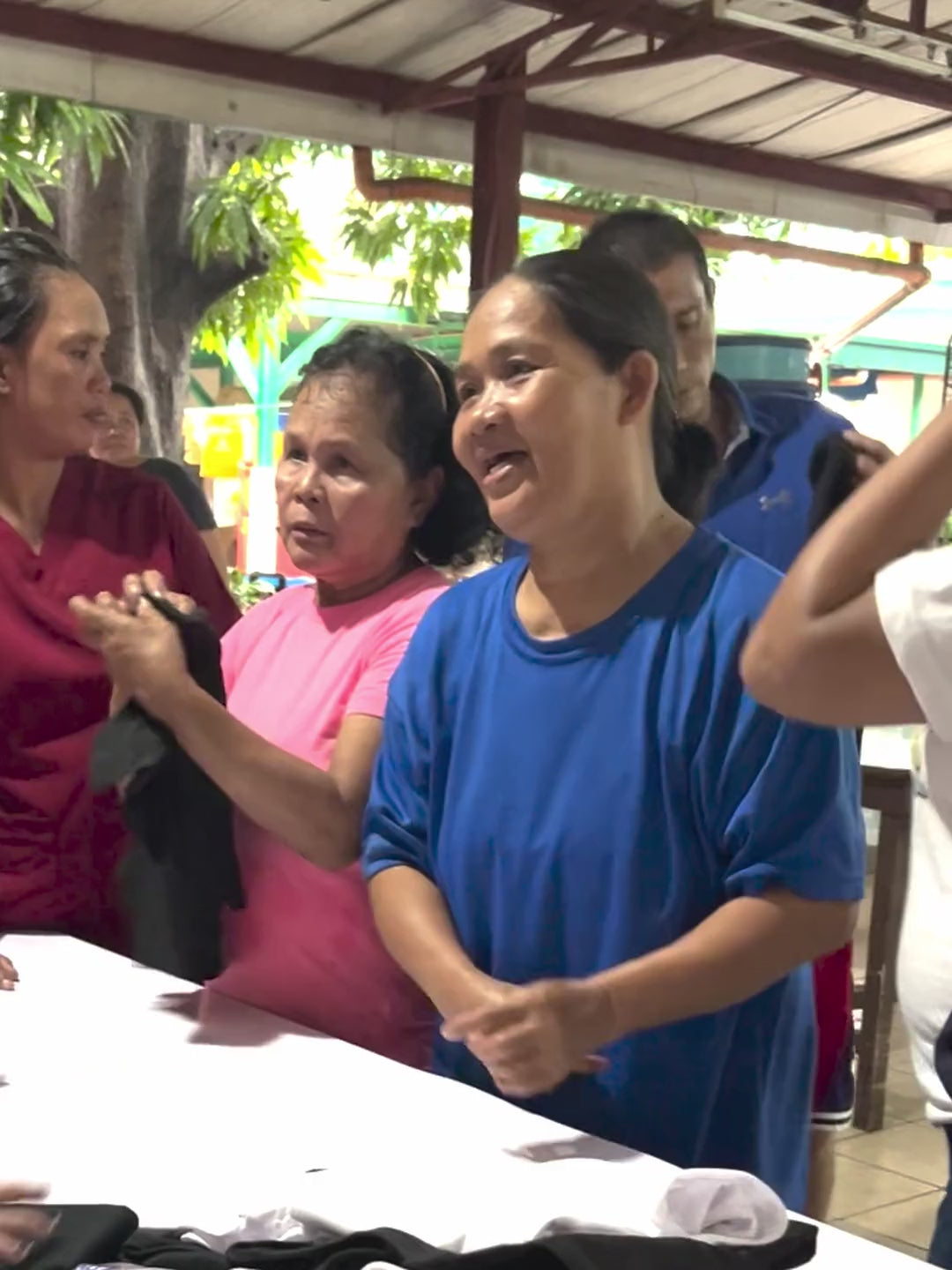 Load video: Caregivers at a home for the aged in Cebu holding up Suroy Wear shirts