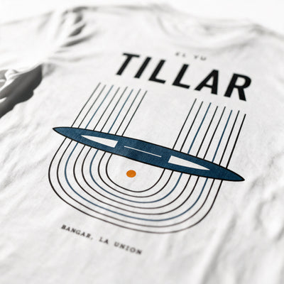Close-up of the Tillar tee back print in white, warp threads, shuttle and woven cloth with one orange point